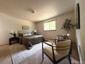 Generous primary suite offers space to relax, unwind, or create your own retreat corner.