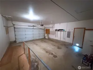 Ample garage space with storage and ramp access—practical and functional.