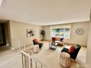Welcome!  Ample living room with views of rear yard just off of entry.