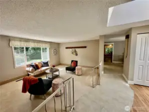 View of living room looking toward dining and kitchen.