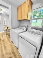 Laundry room with cabinets is just off kitchen. Washer and Dryer included!