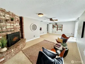 Another view of family room and fireplace.