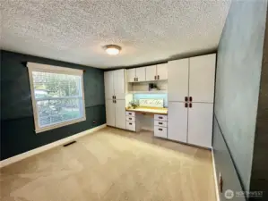 Generous 3rd bedroom features built-in desk and storage.