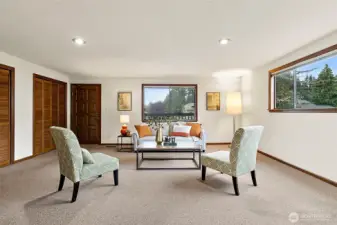 Comfortable sitting room on main level past the kitchen and dining areas.