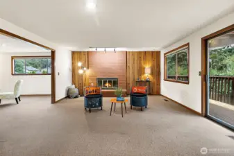 Cozy fireplace at the end of the dining area.