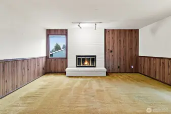 Upstairs rec room with cozy fireplace!