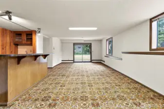 Open room on lower level with built in bar. Pool table? Pinball machine?