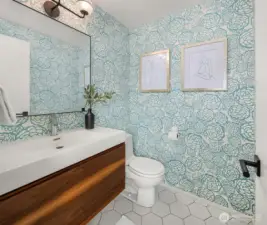 Whimsical powder room with custom vanity