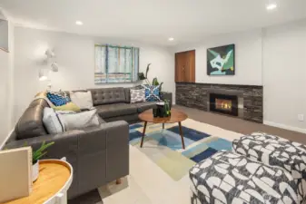 Cozy basement with gas fireplace for movie nights or recreation