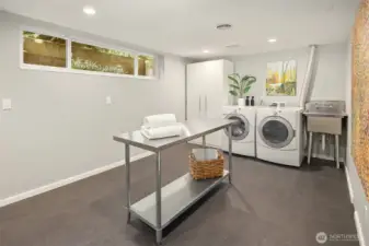 HUGE laundry room with utility sink