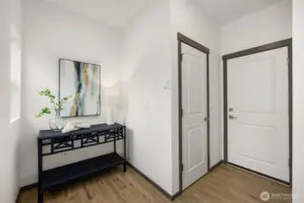 Three stories with spacious entry and lower level attached garage complete with EV Charging Station.