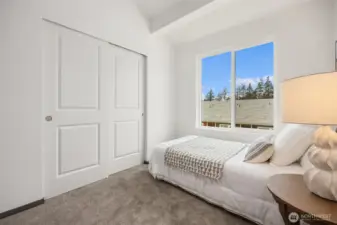 Thoughtfully designed secondary bedroom offering both comfort and utility.