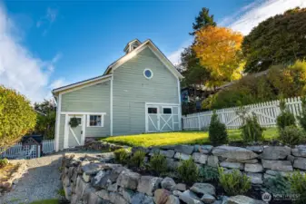 Vintage carriage house with fenced yard.