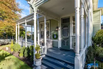 Wrap around front porch with classic Victorian details.