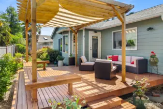 Complete with an impressive pergola, sun sail and built in benches this deck has it all!