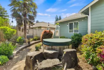 Walk down the paver path surrounded by spectacular landscaping to your own hot tub!