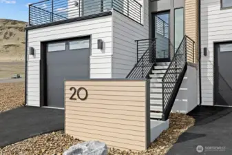 Gorgeous townhomes featuring expansive windows, ample parking, and multiple outdoor decks.