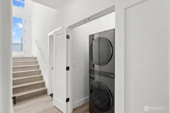 Laundry closet conveniently located for easy everyday living.