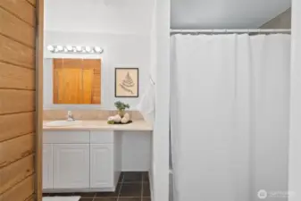 Full bathroom downstairs with sauna