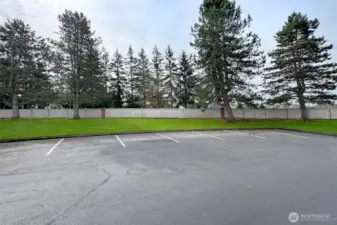 There are 2 large guest parking areas near this home.