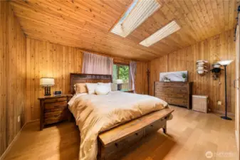 This primary suite has lots of natural light and feels warm and cozy.