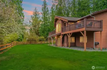 Fenced backyard that overlooks the rest of the property.