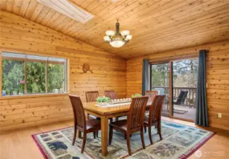 Skylights over the dining area bring in lots of natural light and keep the space feeling light and bright with the vaulted ceilings.
