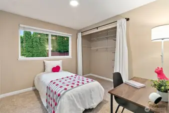 There is ample closet space in all of the bedrooms, including this cute first bedroom down the hallway.