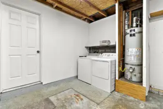Washer and dryer are conveniently located in the garage, just off the kitchen and dining.