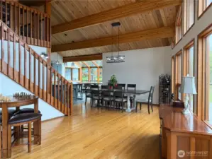 Large dining area & bright kitchen with glass breakfast nook with a view.