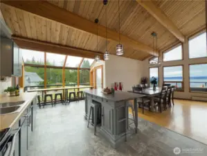 Kitchen with island, breakfast nook & open to the large dining area.