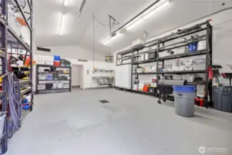 DETACHED GARAGE  • 22’ x 35’ building  • Fully finished with automatic garage door  • Half bathroom   • Industrial triple sink  • Indoor/outdoor dog kennel with easy-clean concrete baseboards and multiple drains  • Storage loft and ceiling hooks for hobbies  • Wired for electric heating