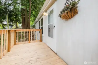 Deck leading up to front door.  Old deck was replaced with this new one in June of 2025.