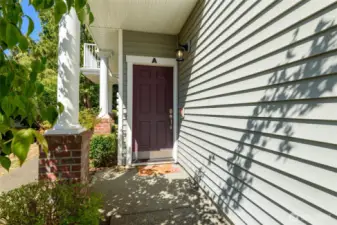 Private entry with covered access.
