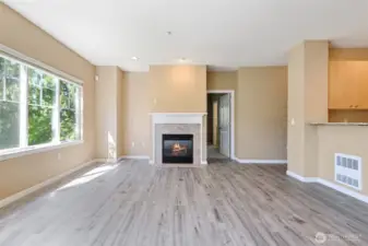 Light-filled living room with large windows.