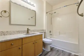 Full bath with tub/shower combo.