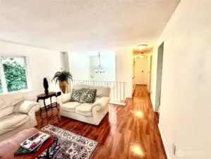 Upper level hallway towards bathroom and 2 bedrooms