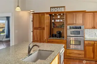 Cabinet opens up to reveal your own personal coffee bar.