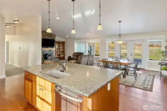 Open concept kitchen, dining and living room