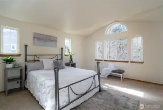 Large primary bedroom upstairs with lots of natural light!