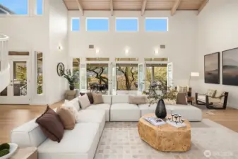 Four sets of double doors dissolve into a 65’ veranda with sweeping Puget Sound views—watching ships pass through the Ballard Locks below.