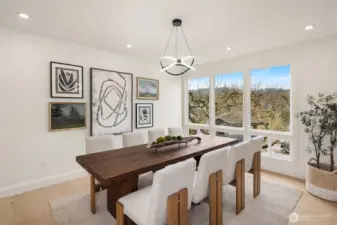 The formal dining room is beautifully appointed with dedicated power and a switch for a serving-bench light—perfect for elevated entertaining.