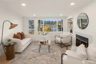 Upper-level family room with a gas/wood-burning fireplace and private view balcony.