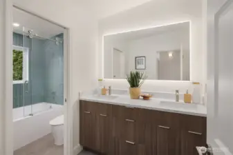 One of three well-appointed full baths upstairs serving the secondary bedrooms.