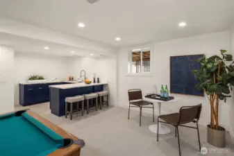 An updated kitchenette on the lower level keeps entertaining seamless—perfect for game nights and gatherings.