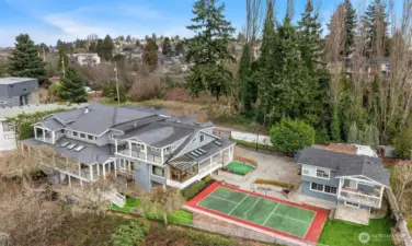 Rare amenities include an indoor squash court, pickleball court, putting green, and generous play and garden areas. A detached ADU adds even more versatility with an additional bedroom and 3/4 bath—ideal for guests, MIL, live-in nanny, or passive income.
