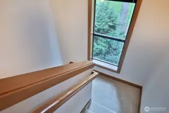 This large window floods the stairway with light.