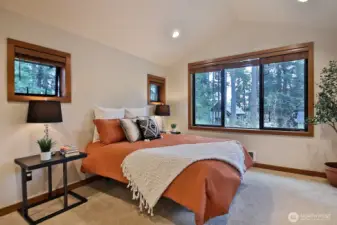 Private upper level Bedroom with lots of windows, yet still private.