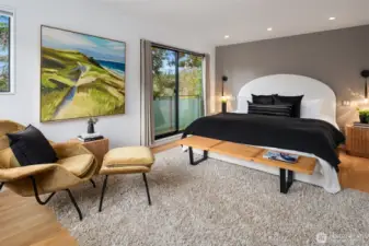 Upstairs, the primary suite is its own sanctuary—so immersed in greenery it feels like you’re floating in the trees—complete with a generous walk-in closet and a spa-caliber bath that must be experienced in person.