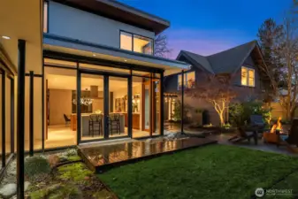 The yard has been professionally landscaped for the intention of both hosting and lingering: a boardwalk element, fountain-style water feature, and bamboo landscaping create texture, privacy, and mood. Irrigation and low-maintenance features keep it easy, including professional bamboo containment.